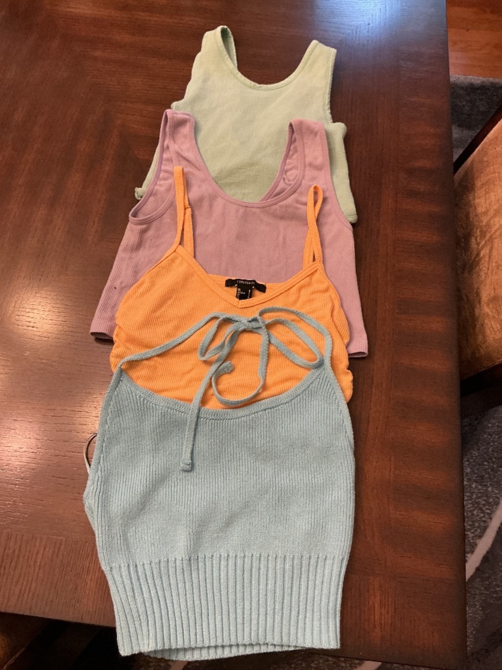 Lot of 4 gently used crop tops.  Size Small